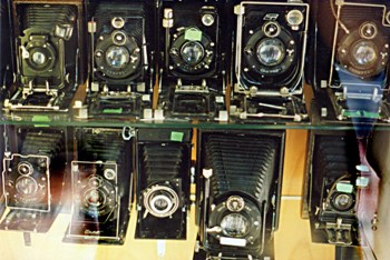 This photo of a store window display of vintage and antique cameras was taken by Adriana Cikopol of Bolzano, Italy.